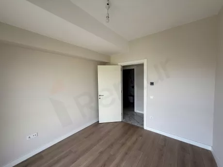 Spacious and bright modern bedroom interior view.