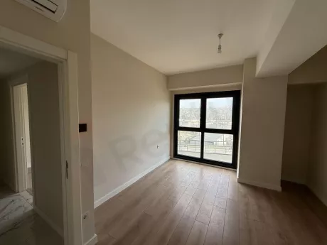 Bright and spacious bedroom area with modern architecture and large windows.