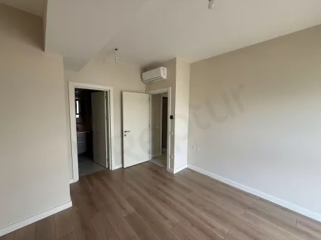 A view of a spacious and bright modern bedroom.