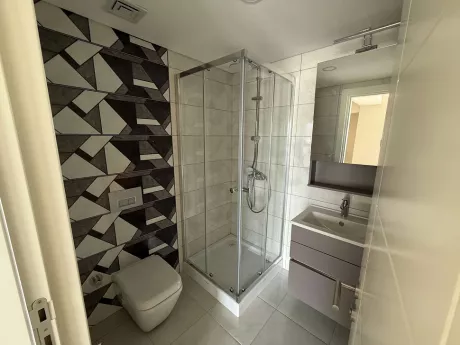 Modern bathroom design with ceramic tiles and stylish sanitaryware.
