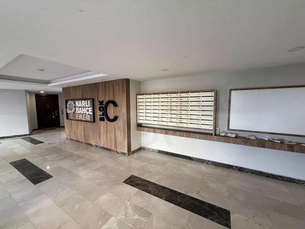 Spacious and brightly lit residence entrance lobby designed with modern architecture.