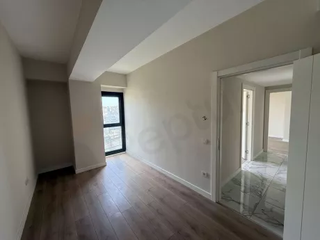 Spacious and modernly designed, bright bedroom interior.