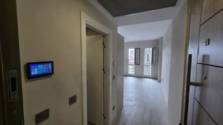 Modern entrance door and hallway area of an apartment.