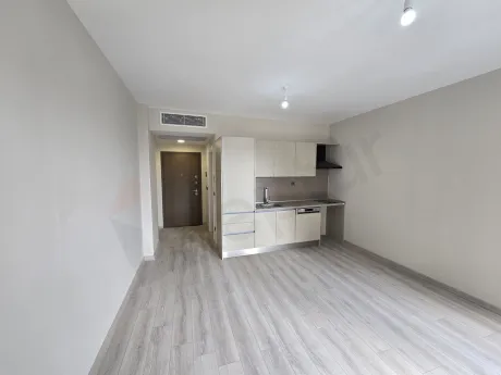A modern and functional open-plan kitchen view with a minimalist design.