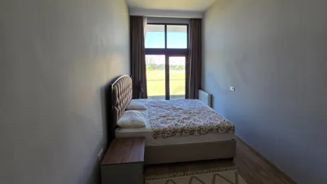 Modern and bright bedroom interior with a spacious design.