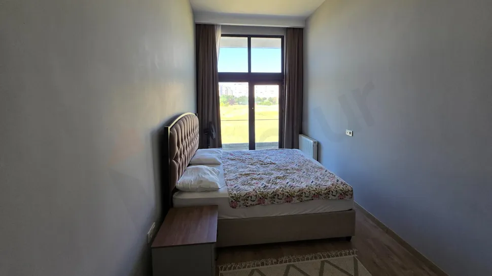 Modern and bright bedroom interior with a spacious design.