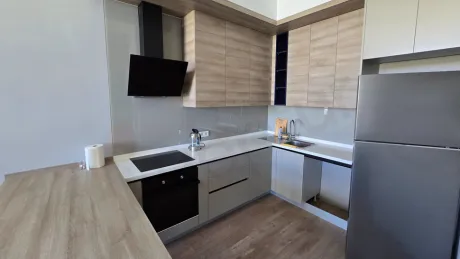 Modern and spacious kitchen area of a stylish apartment