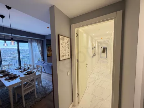 Bright hallway of a modernly decorated and furnished spacious apartment.