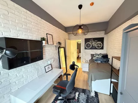 Modern furnished, spacious and bright bedroom interior view.