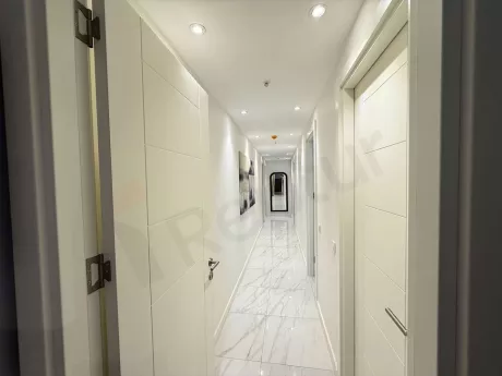 View of a wide and bright corridor in the interior of a modern building.