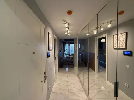 Interior view of a modern apartment entrance hall and foyer.