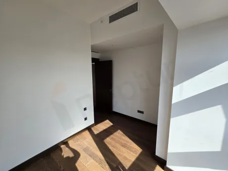 Interior view of a modern, spacious, and bright bedroom.