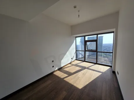 Modernly designed bedroom interior with large windows and natural light in Sisli.