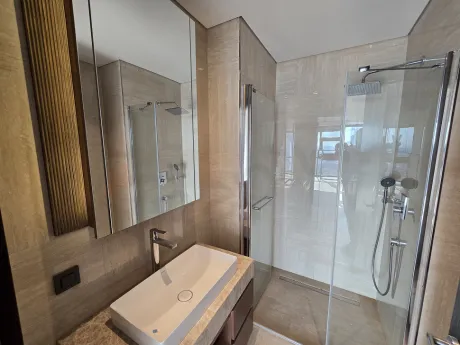 Modern and stylish interior view of a spacious bathroom