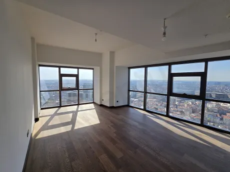 A view of a modern and spacious living room area.