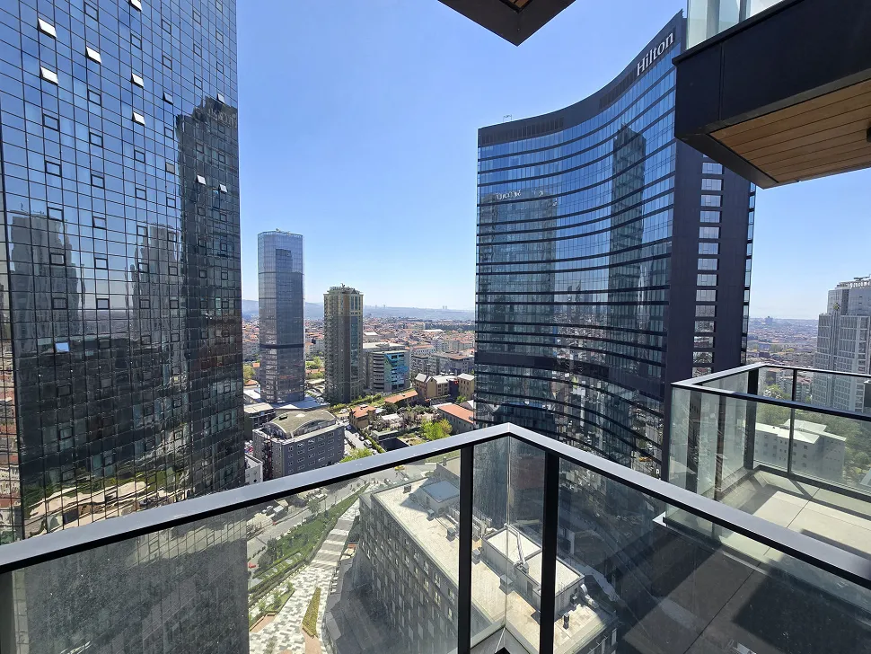 Spacious balcony of a modern residence apartment in Sisli overlooking the city.