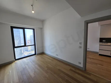 Interior view of a modern and spacious bedroom in a bright residence apartment