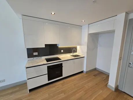 Spacious and bright kitchen area with a modern design.