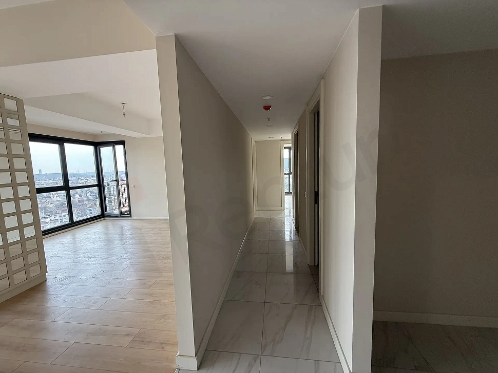 A spacious and bright apartment corridor located in a modern building.