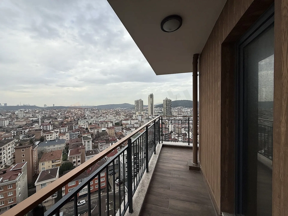 Spacious and bright balcony area on the exterior of a modern building.