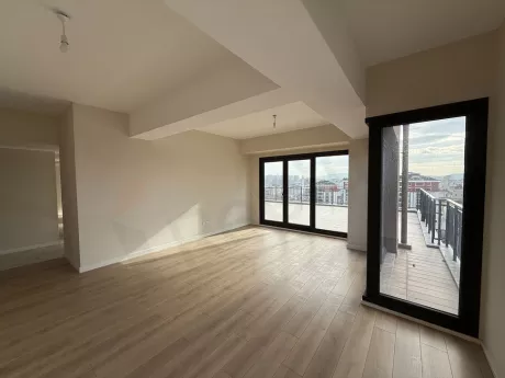 Spacious and bright living room with large windows in a 3+1 apartment in Cekmekoy, Istanbul.
