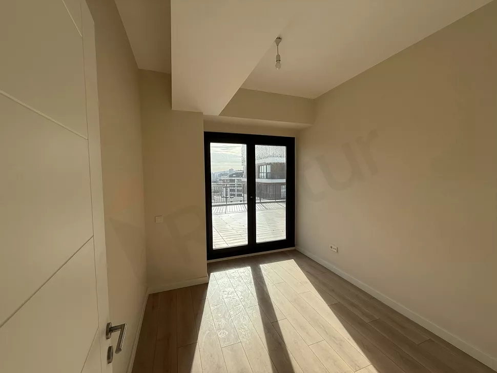 Spacious, bright, and airy bedroom view of a modern apartment.