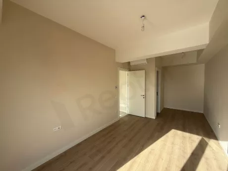 Interior view of a spacious and modern bedroom.