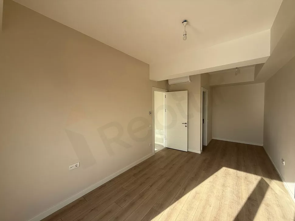 Interior view of a spacious and modern bedroom.