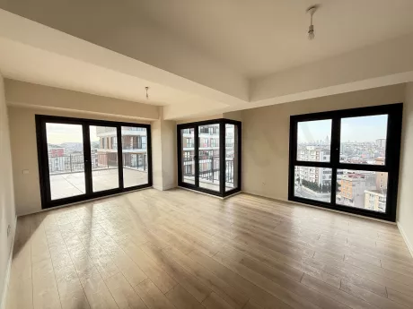 Spacious and bright living room area with large windows and modern architectural design.