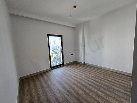 Photograph of a bright and spacious designed bedroom.