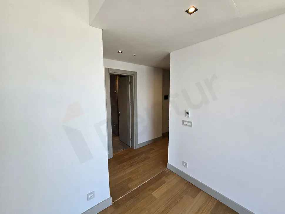 A large and spacious living room area with natural light.