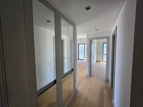 Spacious and bright corridor view of a modern residence apartment.