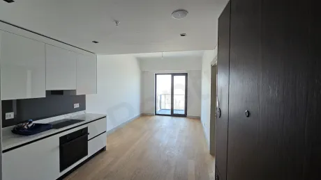Bright living room area with modern design and large windows.