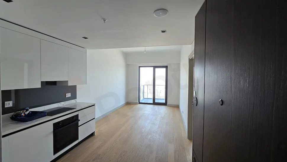 Bright living room area with modern design and large windows.
