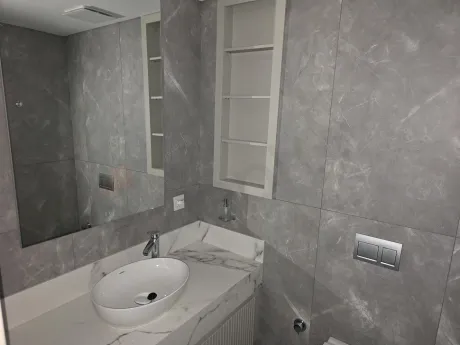 Modernly designed luxury bathroom view with stylish ceramic tiles and high-quality sanitaryware.
