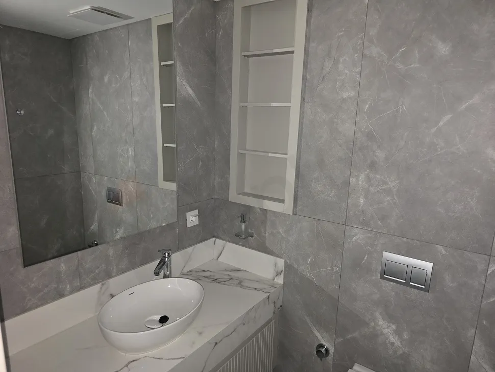 Modernly designed luxury bathroom view with stylish ceramic tiles and high-quality sanitaryware.
