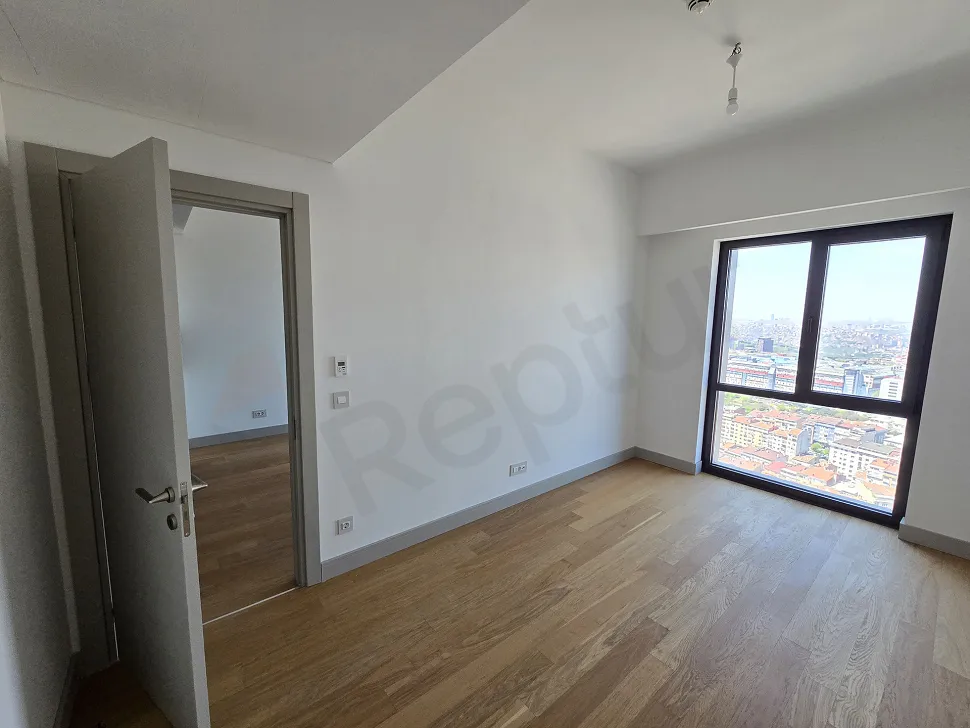 Spacious and bright bedroom interior of a modern residence apartment.