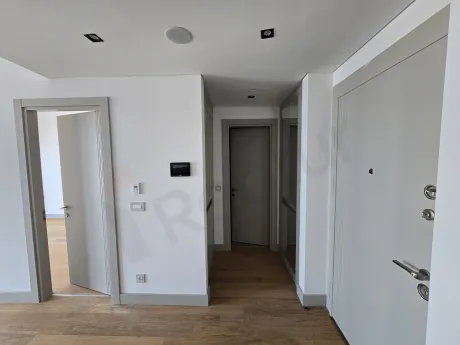 Stylish and bright apartment entrance area located in a modern residence building.