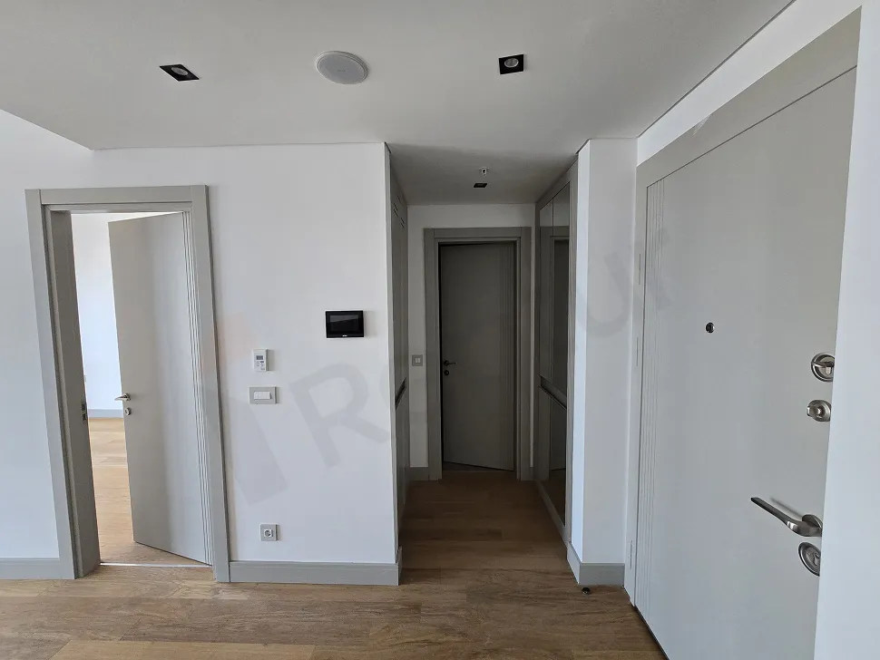 Stylish and bright apartment entrance area located in a modern residence building.