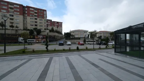Spacious open outdoor parking area and parking spaces in front of a building complex in Basaksehir.