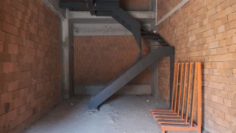 Elegant indoor staircase design inside a modern commercial building.