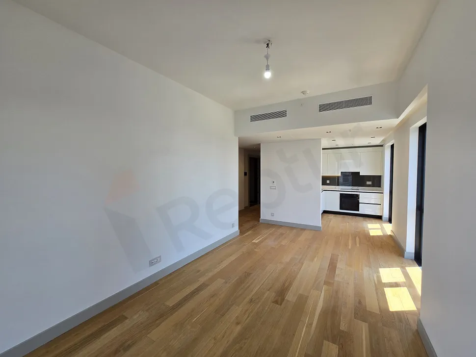 Bright empty living room with modern architecture, large windows and city view in Sisli.