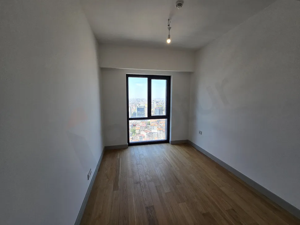 Spacious and bright bedroom image of a modern residence apartment for sale in Sisli, Istanbul.