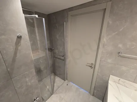 Modern bathroom design with stylish ceramic tiles and bathroom fixtures.