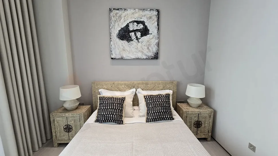 View of a modern, spacious, and bright bedroom design.