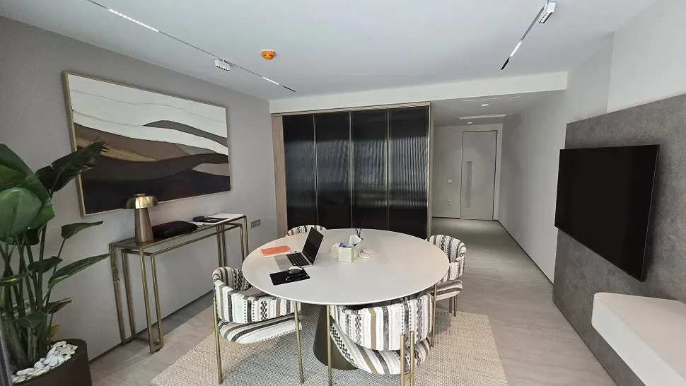Spacious and bright dining room area of a detached house with modern architecture.