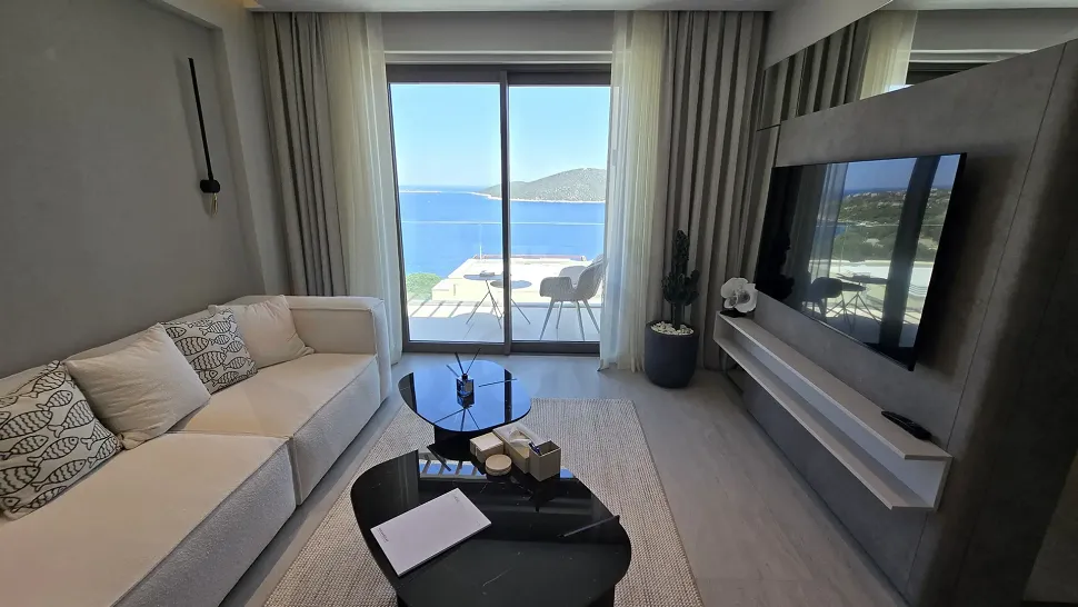A bright living room area with large windows, spacious and modern design.