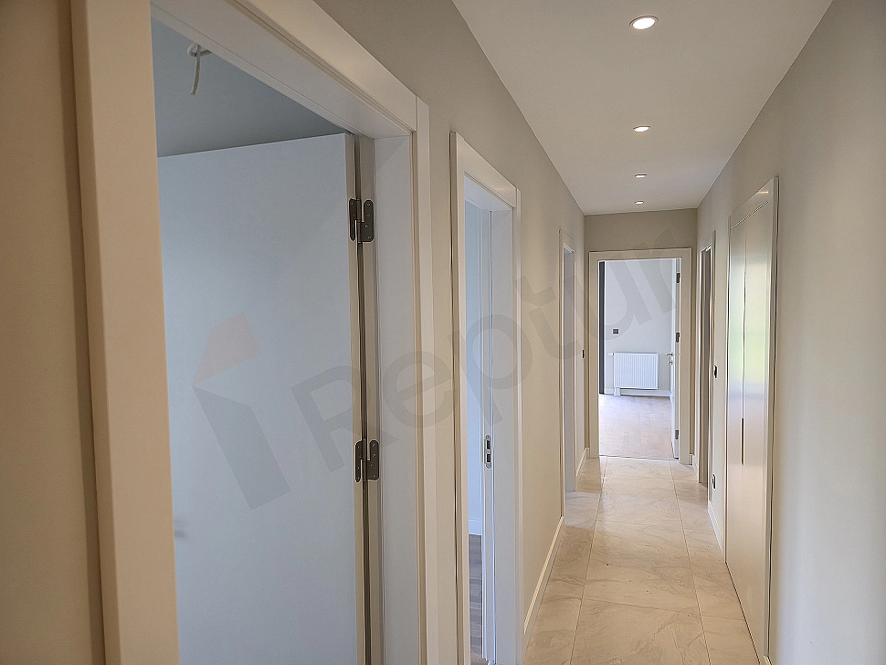 Interior of a modern apartment corridor, bright and spacious design.