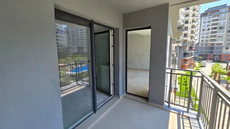 Resort-Style Vista: Spacious 4+1 Residence with Dual Balconies Overlooking the Pool
