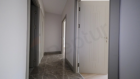 Interior photograph of a bright and spacious corridor.